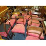 A SET OF THIRTEEN GEORGIAN MAHOGANY DINING CHAIRS WITH TWIST MID RAILS AND RAISED ON TURNED SUPPORTS