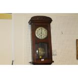 A VINTAGE OAK CASED GONG STRIKE WALL CLOCK