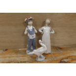 A LLADRO FIGURE OF A BOY IN DUNGAREES, A GIRL IN A NIGHTDRESS & A GOOSE (3)