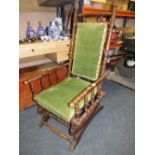 A VINTAGE AMERICAN ROCKING CHAIR WITH UPHOLSTERED DETAIL