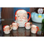 A ROYAL DOULTON SANTA CLAUS D6705 CHARACTER JUG TOGETHER WITH FOUR MINIATURE EXAMPLES D7060, D6950