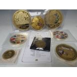 A COLLECTION OF GOLD PLATED AND DECORATIVE OVERSIZE PROOF COINS, to include George & The Dragon, the