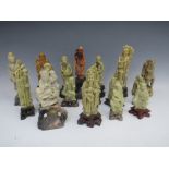 A COLLECTION OF ORIENTAL CARVED SOAPSTONE FIGURES / DEITIES, comprising fourteen individual