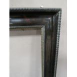 A 19TH CENTURY DUTCH TORTOISESHELL EBONISED FRAME, with thin gold slip, frame W 8 cm, rebate 42 x 66