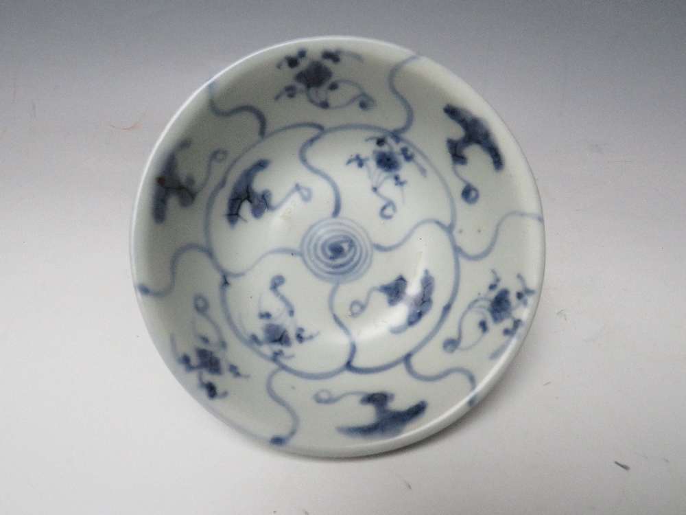 A CHINESE TEK SING CARGO BLUE AND WHITE BOWL WITH LOTUS DECORATION, retaining Nagel Auctions label