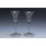 A PAIR OF ANTIQUE WINE GLASSES, both with bubble in stem, H 18.5 cm