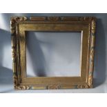 AN EARLY 20TH CENTURY GOLD AND BLUE DECORATIVE FRAME, with slip, frame W 7 cm, rebate 63 x 72 cm