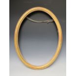 A 19TH CENTURY OVAL GOLD FRAME, frame W 4 cm, rebate 62 x 47 cm