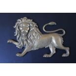 A BRONZE PLAQUE OF A LION RAMPANT, W 23.5 cm