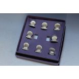 A BOXED SET OF EIGHT CLAM SHELL MENU HOLDERS, box W 16 cm