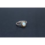 A VINTAGE OPAL AND DIAMOND RING, in a traditional setting, ring size M 1/2