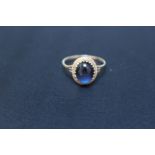 A HALLMARKED 9 CARAT GOLD RING, set with a cabochon sapphire style stone, approx weight 1.6g, ring