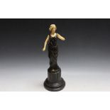 A FIGURE OF A LADY ON A MARBLE BASE, H 42.5 cm
