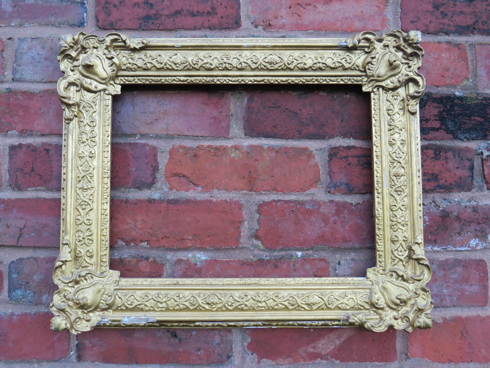 A 19TH CENTURY DECORATIVE GOLD FRAME WITH CORNER EMBELLISHMENTS, frame W 7.5 cm, rebate 40 x 30 cm