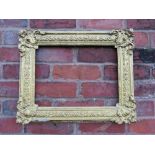 A 19TH CENTURY DECORATIVE GOLD FRAME WITH CORNER EMBELLISHMENTS, frame W 7.5 cm, rebate 40 x 30 cm