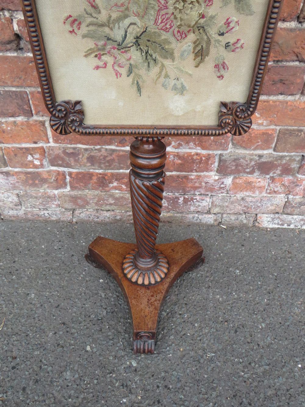 A 19TH CENTURY MAHOGANY POLE SCREEN, having a shaped glazed needlepoint adjustable floral screen, - Image 3 of 3