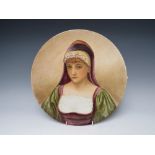 A PINDER BOURNE & Co CHARGER DEPICTING A LADY IN A HOODED ROBE, with impressed marks to the
