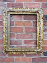 A 19TH CENTURY DECORATIVE GOLD FRAME, decoration is moulded card laid on to a wooden base, frame W 9