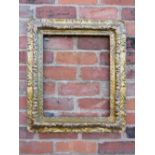A 19TH CENTURY DECORATIVE GOLD FRAME, decoration is moulded card laid on to a wooden base, frame W 9