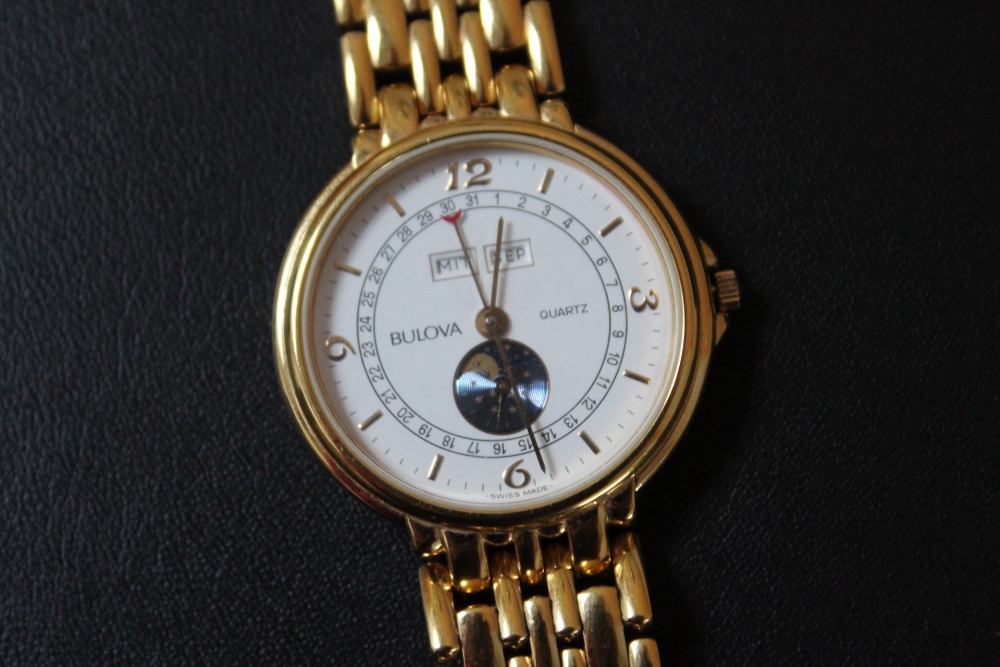 A CONTINENTAL DAY MONTH BULOVA MOON PHASE QUARTZ WRIST WATCH, Dia 3.5 cmCondition Report:working - Image 2 of 3