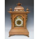 A LARGE JUNGHANS WESTMINSTER CHIME MANTLE CLOCK, the architectural case having mahogany veneers,