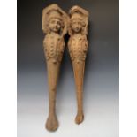 A PAIR OF LATE 17TH / EARLY 18TH CENTURY CARIATE TABLE LEGS A/F, with carved effigies of young