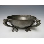 A LARGE ART NOUVEAU LIBERTY STYLE PEWTER BOWL, raised on four out swept feet, unsigned, Dia. 26