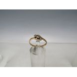 AN 18CT GOLD AND DIAMOND THREE STONE CROSSOVER RING, size N ½, approximately 2.01 g