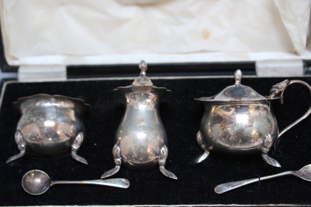 A CASED HALLMARKED SILVER THREE PIECE CRUET SET - BIRMINGHAM 1933, together with two salt spoons, - Image 2 of 2