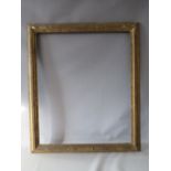 A 19TH CENTURY GOLD FRAME, with designs to inner and outer edges, in need of some restoration, frame