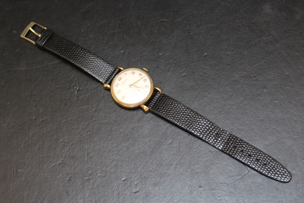 A 9CT GOLD TIMOR WRIST WATCH, on replacement leather strap, presentation engraving to reverse, Dia