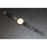 A 9CT GOLD TIMOR WRIST WATCH, on replacement leather strap, presentation engraving to reverse, Dia