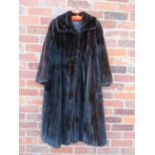 A VINTAGE DARK CHOCOLATE BROWN FULL LENGTH MINK FUR COAT RETAILED BY HARRODS, fully lined,