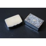 A HALLMARKED SILVER PILL BOX - BIRMINGHAM 1924, together with a hallmarked silver matchbox cover,