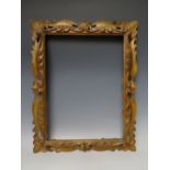 A 19TH CENTURY DECORATIVE CARVED WOODEN PIERCED GOLD FRAME, frame W 5 cm, rebate 30 x 40 cm