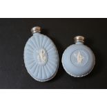 TWO HALLMARKED SILVER LIDDED WEDGWOOD JASPERWARE PERFUME BOTTLES, tallest 7.5 cm