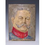 A COLOURED PORTRAIT STUDY IN RELIEF ON CAST IRON PLAQUE, of General Feldmarschall von Hindenberg,