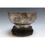 LUENWO SHANGHAI - A CHINESE SILVER BOWL ON STAND, decorated with a floral design, marks to base,