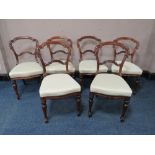 A SET OF SIX 19TH CENTURY ROSEWOOD CROWN BACK DINING CHAIRS, raised on shaped turned supports