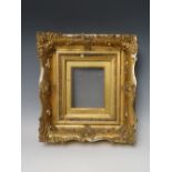 A 19TH CENTURY GOLD SWEPT FRAME, with gold slip and glazed, in need of some restoration, frame W 8