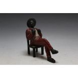 A COLD PAINTED BRONZE FIGURE OF A SEATED DANDY, H 11.5 cm
