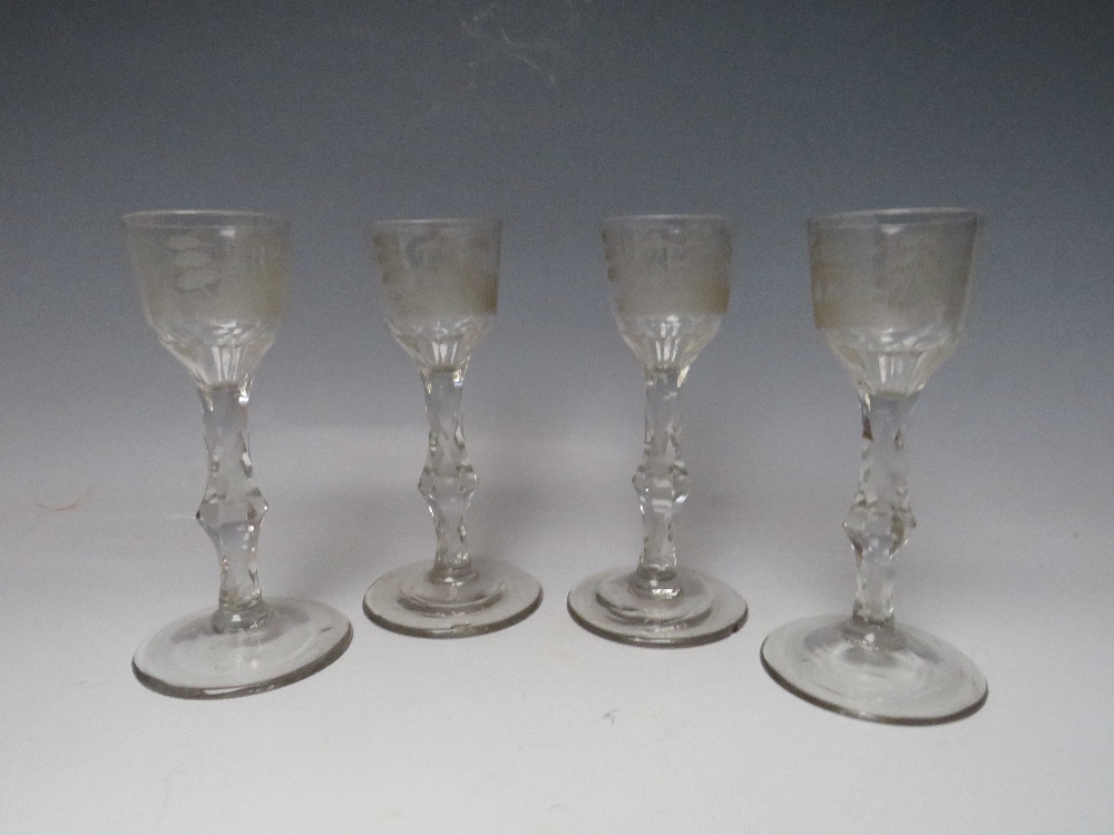 A SET OF FOUR LATE 18TH CENTURY GEORGIAN WINE GLASSES, each having bowl engraved with Oriental and