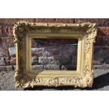 AN 18TH CENTURY DECORATIVE GOLD SWEPT FRAME WITH GOLD SLIP, frame W 8.5 cm, 26 x 36 cm