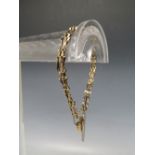 A 9CT GOLD THREE BAR GATE BRACELET, marked 375 to heart shape clasp, approx weight 3.65 g