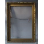 AN EARLY 20TH CENTURY GOLD FRAME WITH LEAF DESIGN TO OUTER EDGE, frame W 8.5 cm, rebate 92 x 61 cm