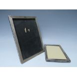 A HALLMARKED SILVER EASEL BACK PICTURE FRAME, rebate 20 x 13 cm, together with a smaller