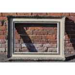 A LATE 19TH / EARLY 20TH CENTURY SWEPT FRAME WITH LINEN SLIP, frame W 5.5 cm, slip rebate 74 x 57