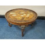 A 20TH CENTURY HARWOOD AND INLAID 'ELEPHANT' CIRCULAR OCCASIONAL TABLE, the top having extensive