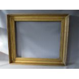 A LATE 18TH / EARLY 19TH CENTURY GOLD PORTRAIT FRAME, frame W 10 cm, rebate 77 x 64 cm