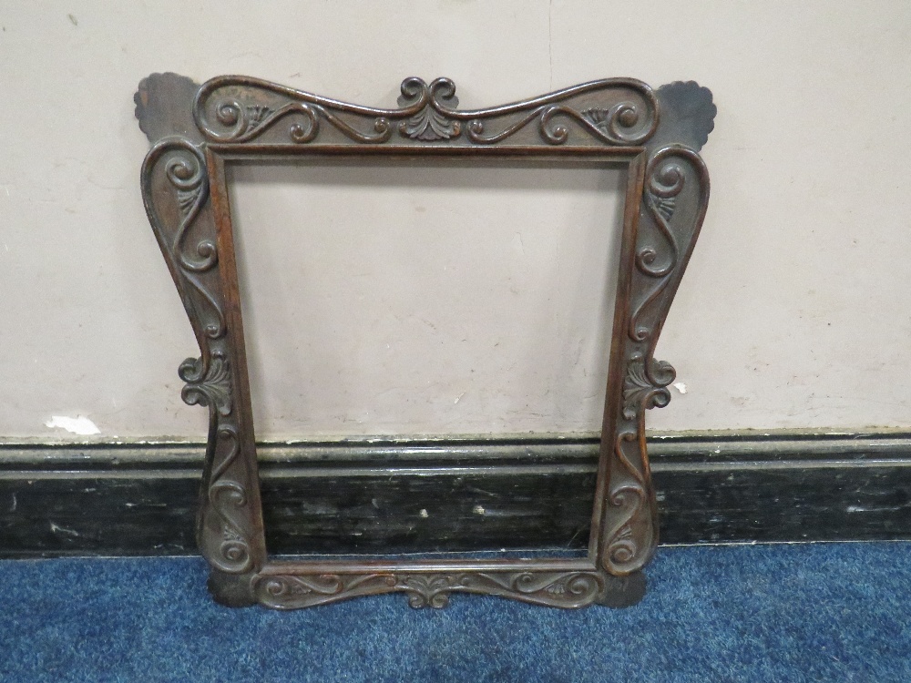 A 19TH CENTURY DECORATIVE DARK HARDWOOD FRAME WITH SCROLLING, widest frame W 7.5 cm, rebate 43 x - Image 2 of 3